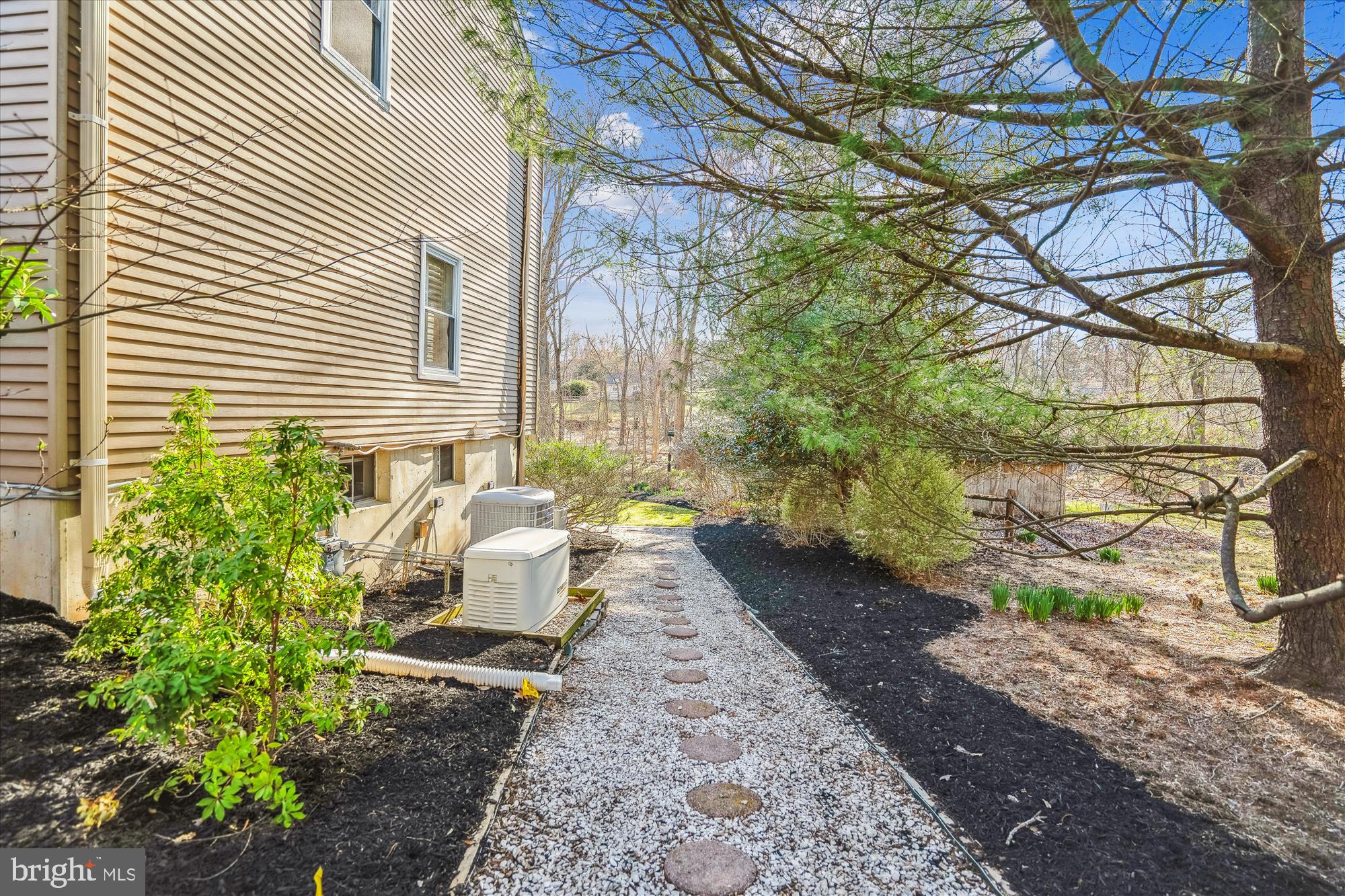 4048 Arjay Circle Ellicott City, MD 21042 - Photo 51 of 56 a view of a backyard with chairs and potted plants