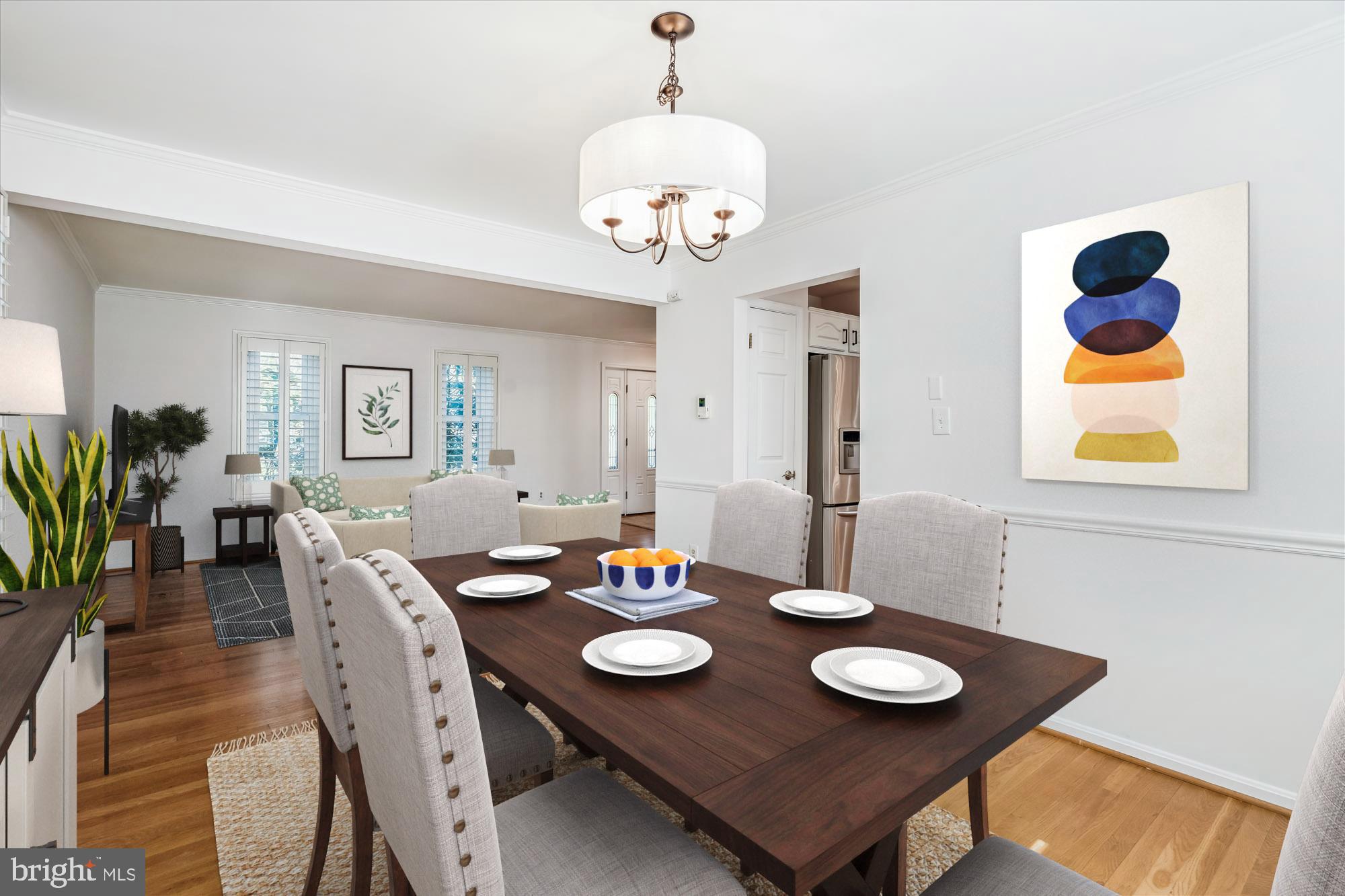 4048 Arjay Circle Ellicott City, MD 21042 - Photo 7 of 56 a view of a dining room with furniture and wooden floor