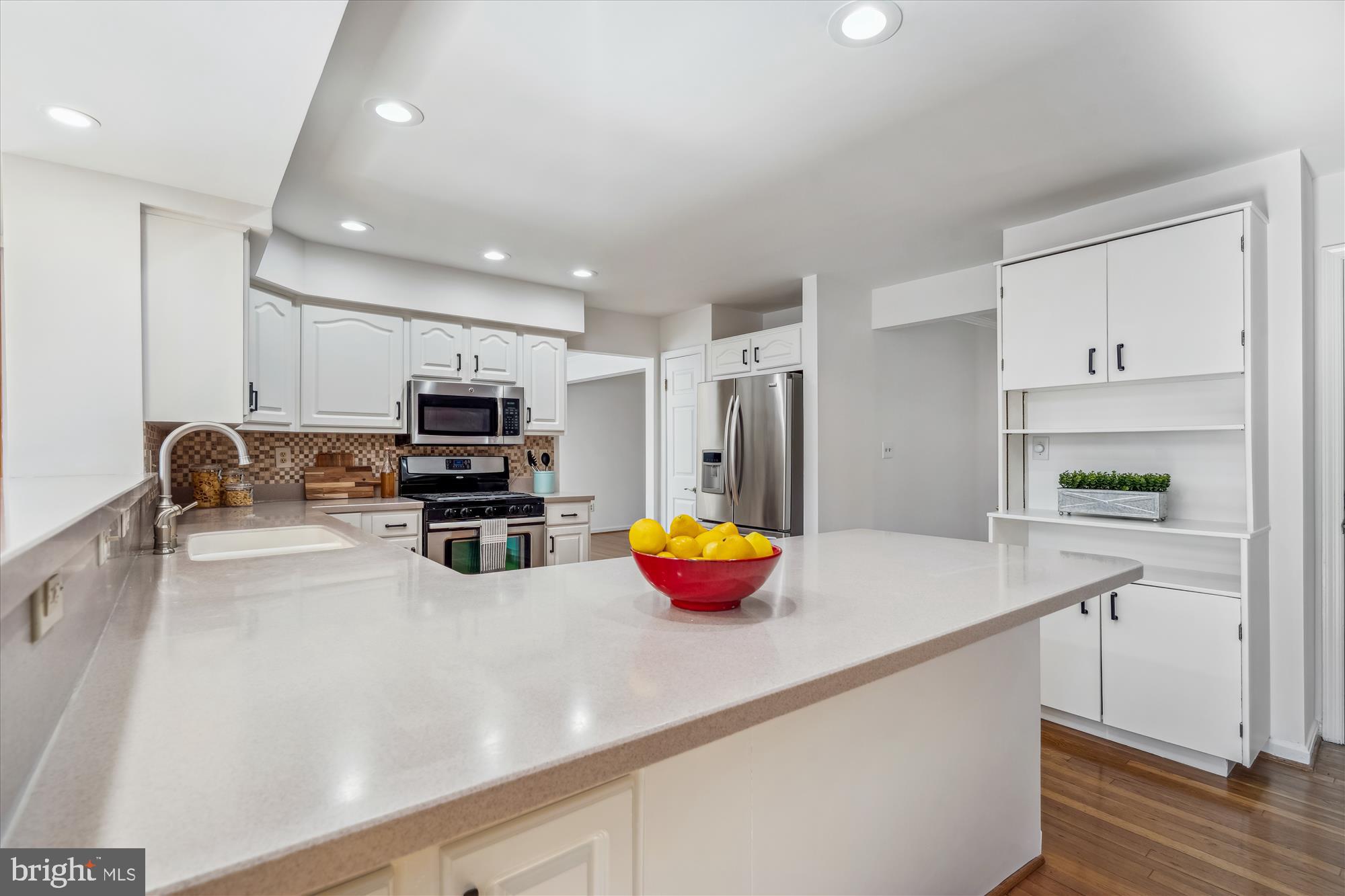 4048 Arjay Circle Ellicott City, MD 21042 - Photo 10 of 56 a kitchen with a refrigerator and a sink