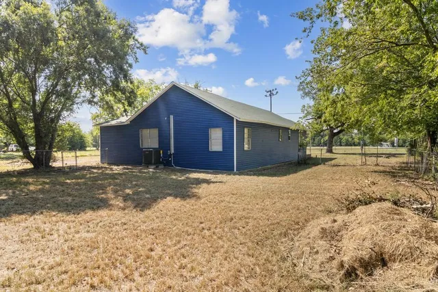 a house view with a backyard space