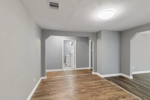 a view of an empty room and window