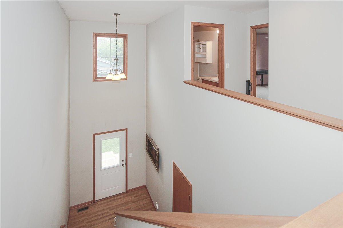 107 Hammond Avenue Wauconda, IL 60084 - Photo 3 of 31 a view of an entryway with wooden floor