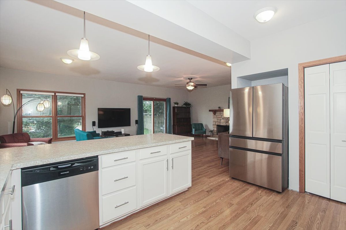 107 Hammond Avenue Wauconda, IL 60084 - Photo 10 of 31 a kitchen with a refrigerator and a stove top oven