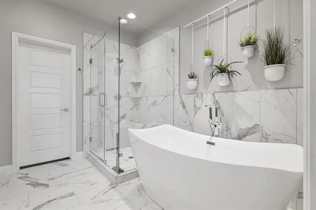 a bathroom with a bathtub and shower