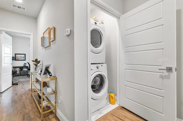 a view of a storage and utility room with washer and dryer