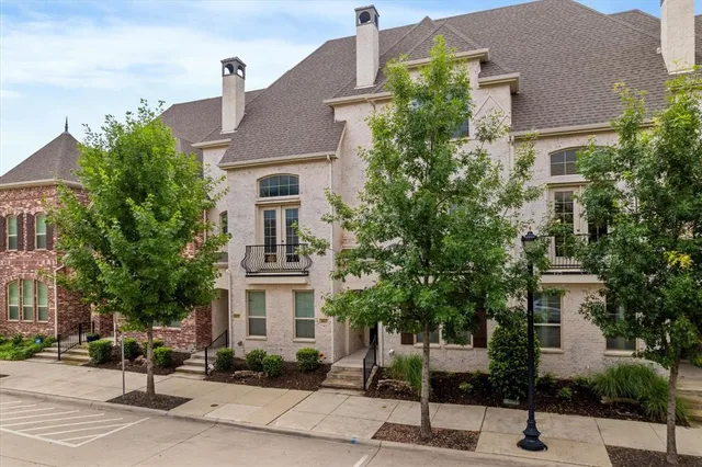 a front view of a residential houses with yard