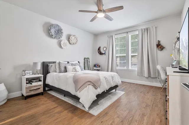 a bedroom with bed and a window