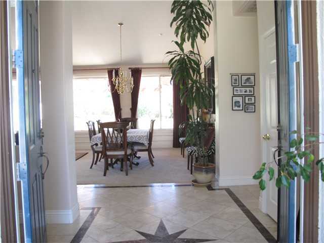 16751 Open View Road Ramona, CA 92065 - Photo 2 of 19 Foyer Entry has detailed tile and opens to great room (Living room and dining room. Drapes do not convey