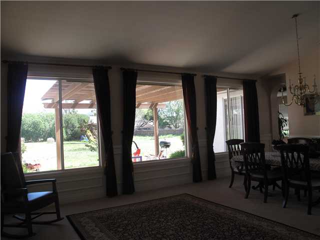 16751 Open View Road Ramona, CA 92065 - Photo 4 of 19 This is a wider angle of Great Room with Dining showing expansive windows to large private back yard.