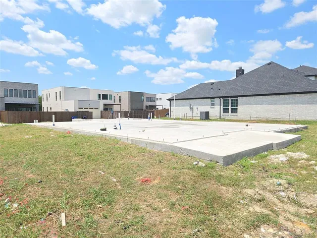 a swimming pool view with a outdoor seating