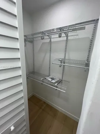 a view of a room with racks on the wall
