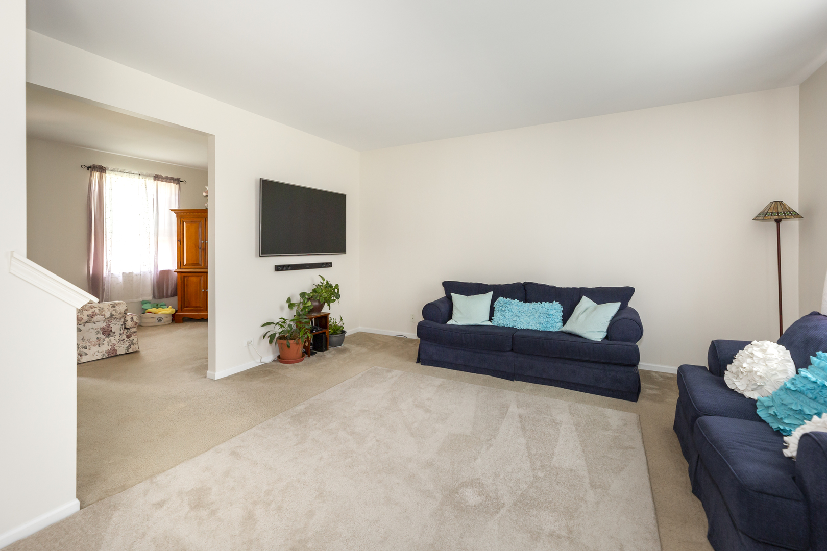 412 Preserve Drive Genoa, IL 60135 - Photo 14 of 39 a living room with furniture and a flat screen tv