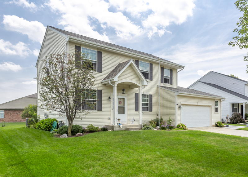 412 Preserve Drive Genoa, IL 60135 - Photo 2 of 39 a view of a yard in front of a house