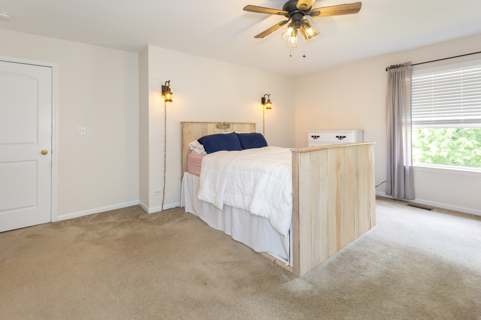 412 Preserve Drive Genoa, IL 60135 - Photo 25 of 39 a bed room with a bed and a chandelier