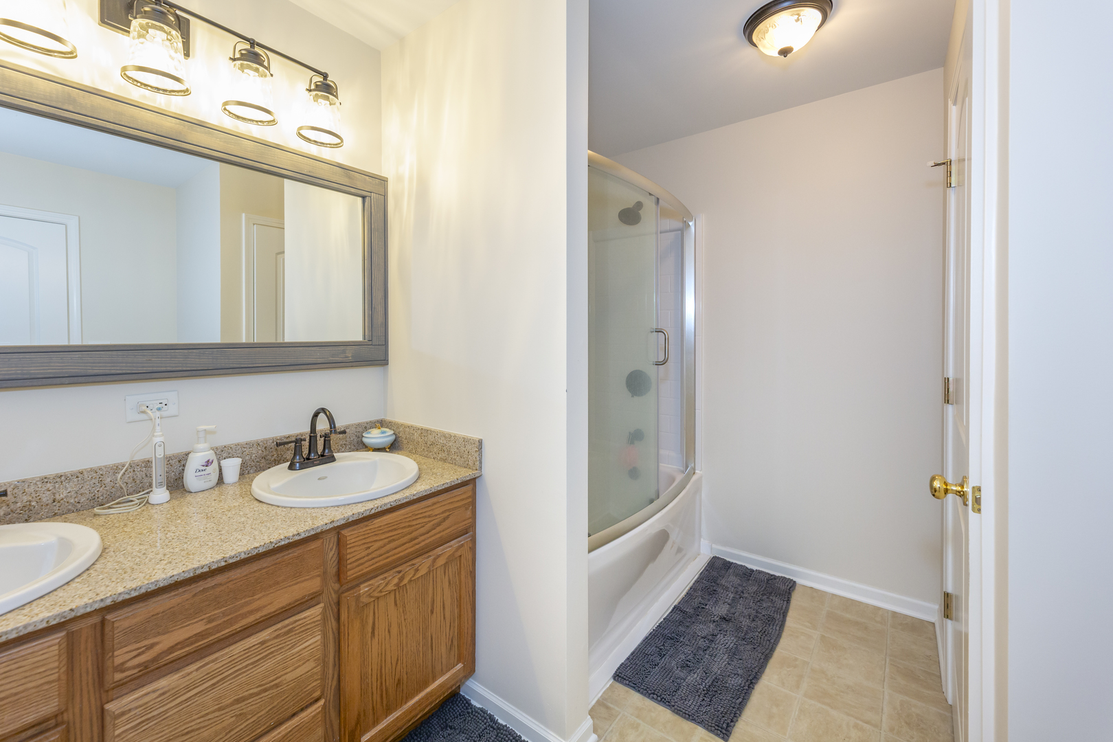412 Preserve Drive Genoa, IL 60135 - Photo 29 of 39 a bathroom with a sink and a mirror
