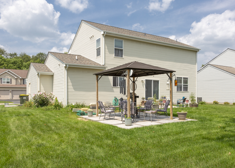 412 Preserve Drive Genoa, IL 60135 - Photo 6 of 39 a front view of a house with patio and garden