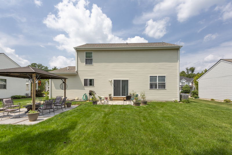 412 Preserve Drive Genoa, IL 60135 - Photo 9 of 39 a view of a backyard with table and chairs and a large tree
