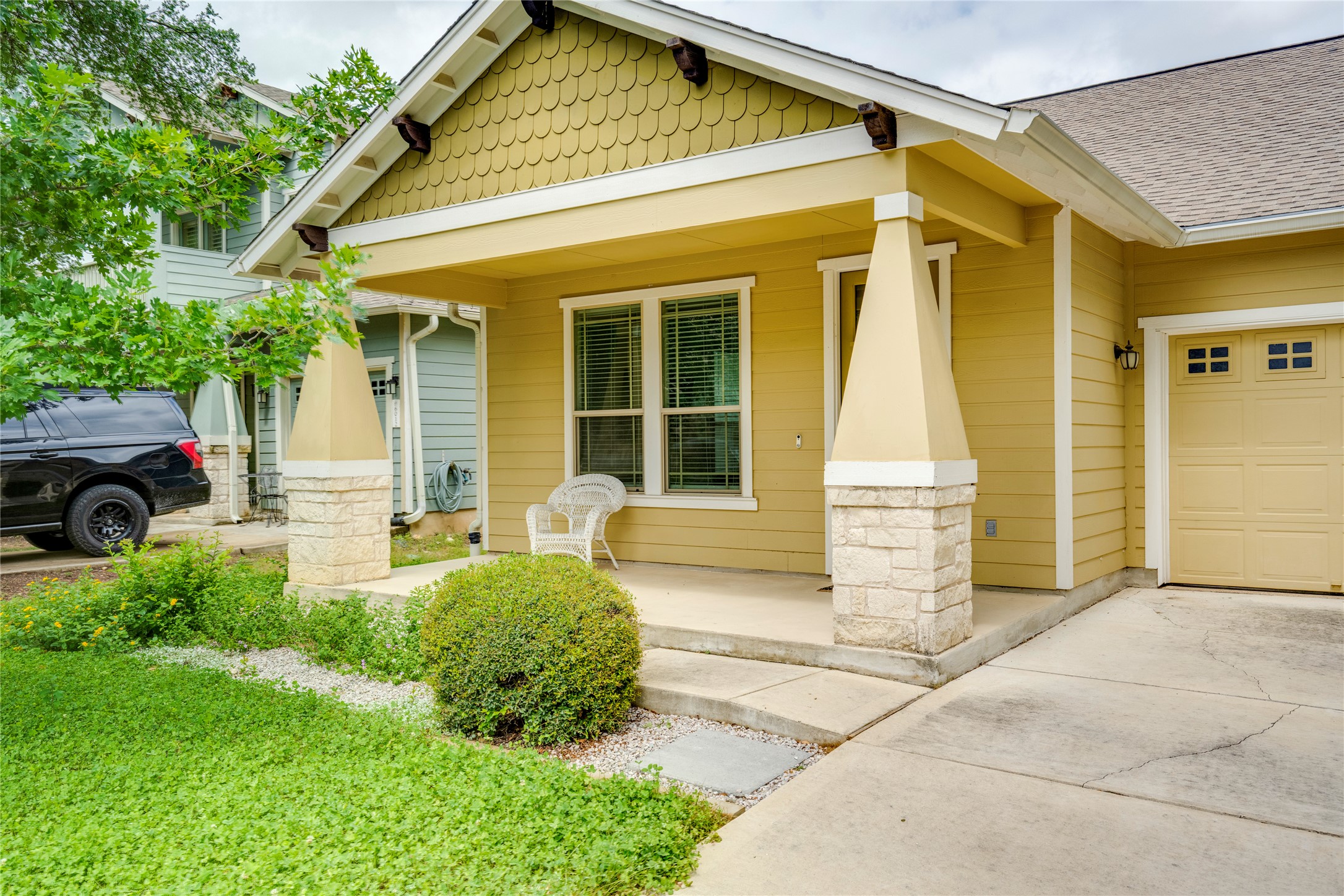 6008 Whipple Way Austin, TX 78745 - Photo 2 of 39 A welcoming front porch with stone-accented columns enhances this cheerful residence's curb appeal.