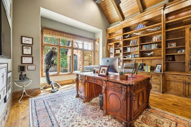 a view of a kitchen with a large window