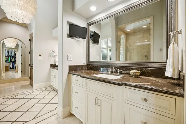 a bathroom with a sink and a mirror