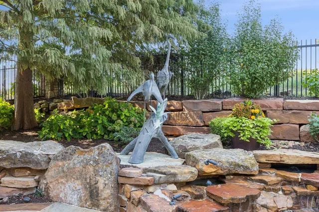 an aerial view of a house with outdoor space and lake view