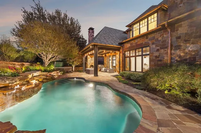 a view of swimming pool with outdoor seating
