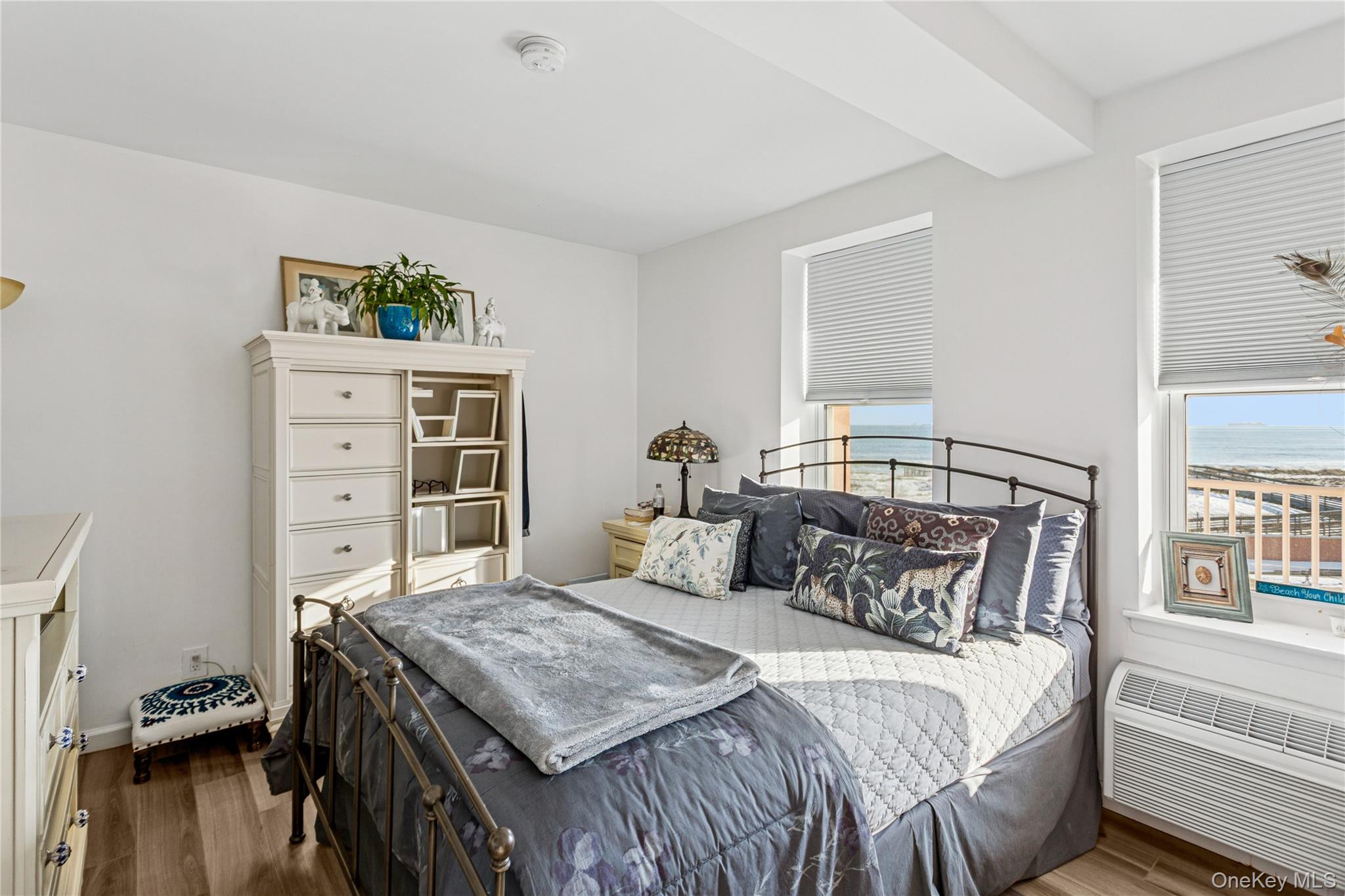 2 Richmond Road, Unit 3B Lido Beach, NY 11561 - Photo 13 of 17 a bedroom with a bed and wooden floor