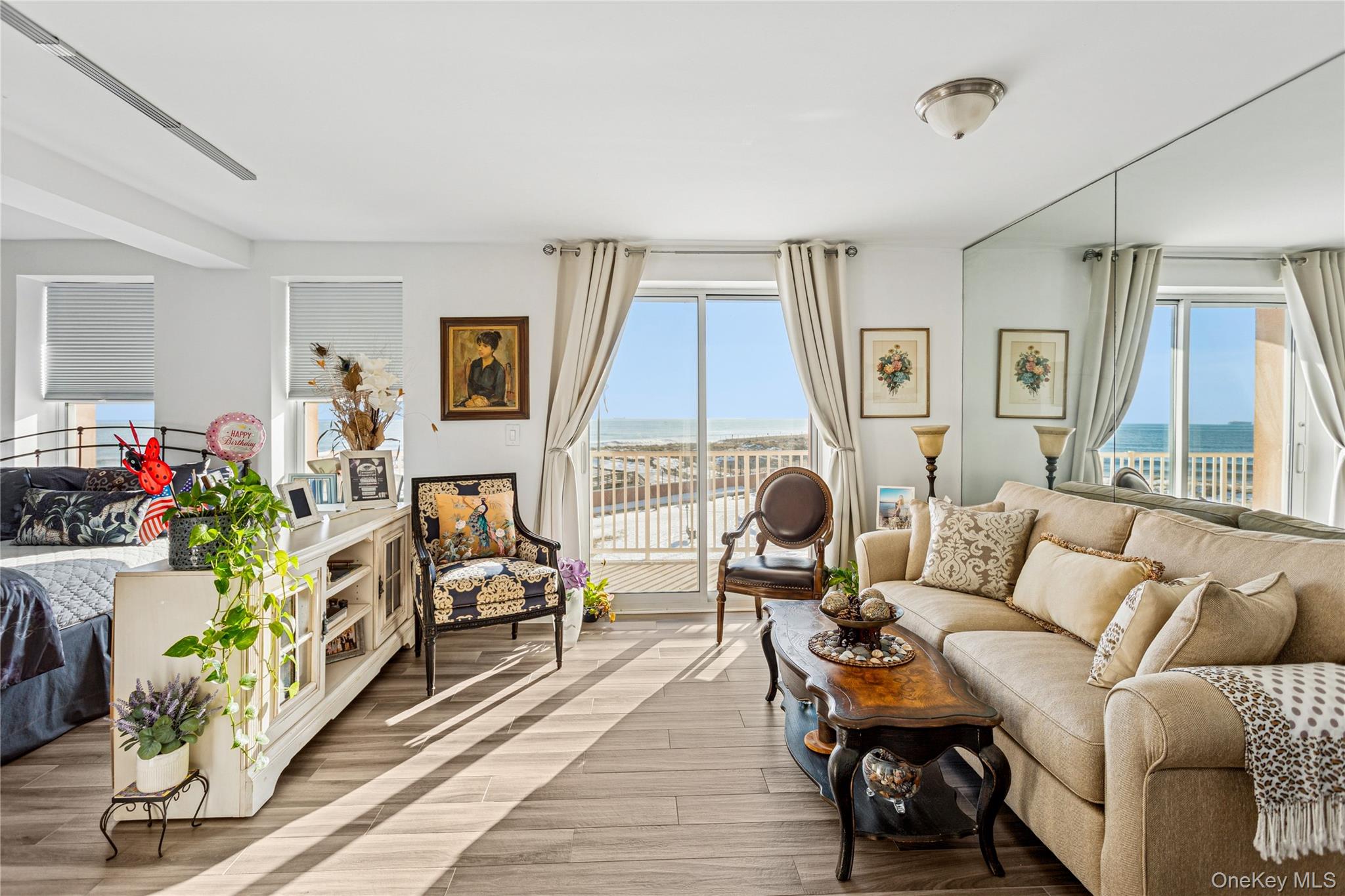 2 Richmond Road, Unit 3B Lido Beach, NY 11561 - Photo 3 of 17 a living room with furniture fireplace and a large window
