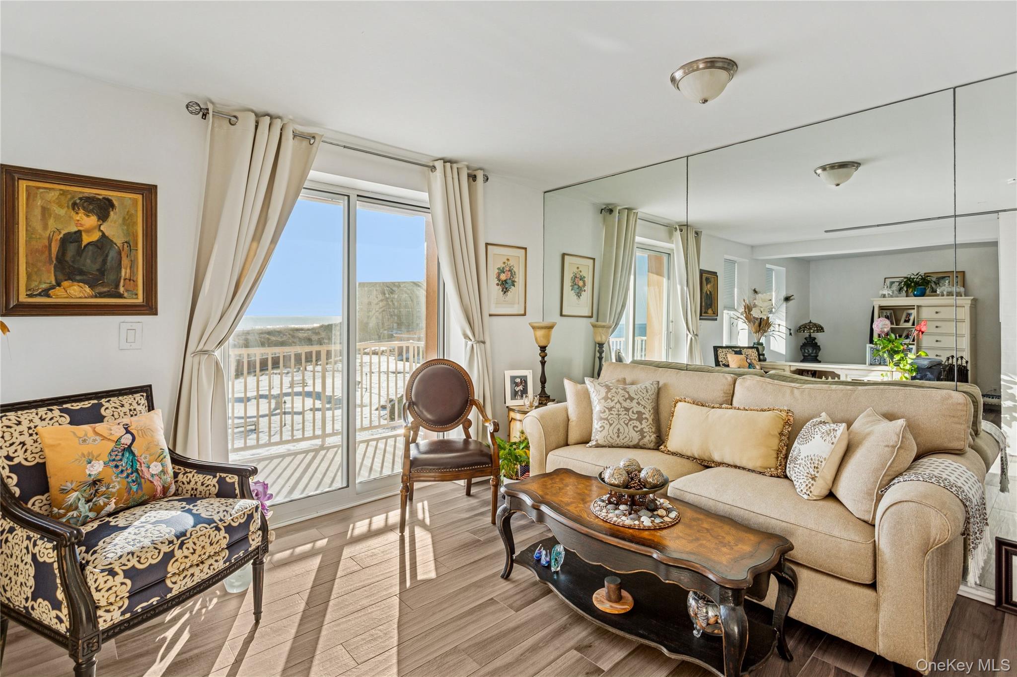 2 Richmond Road, Unit 3B Lido Beach, NY 11561 - Photo 5 of 17 a living room with furniture and a large window