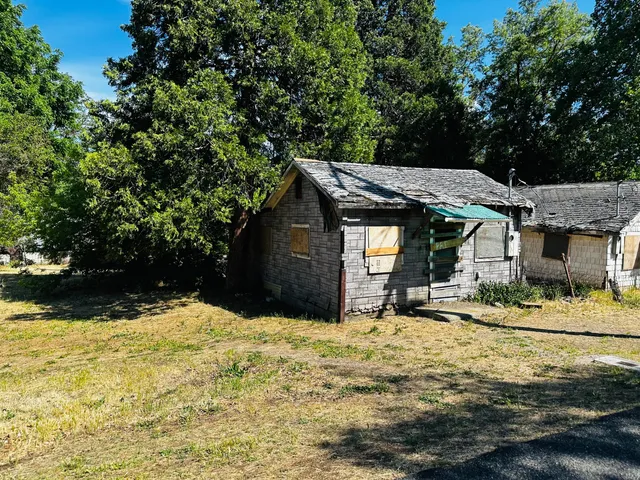 a view of a house with snow on the side of it