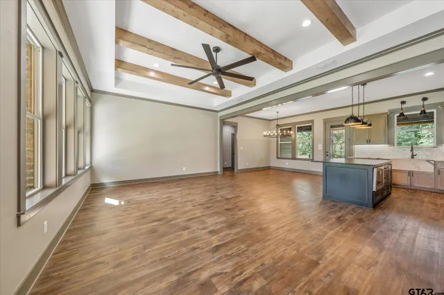 a view of a livingroom with furniture window and wooden floor