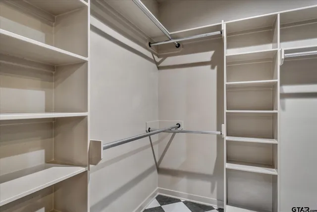 a view of an empty walk in closet