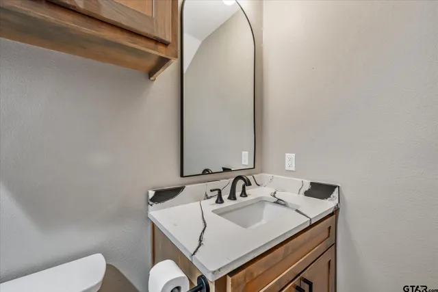 a bathroom with a sink and a toilet