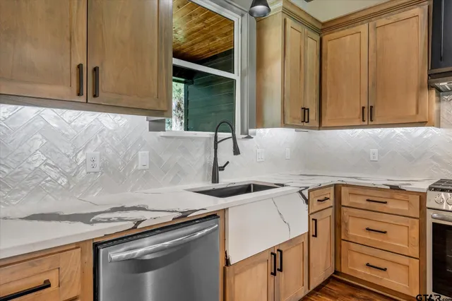 a kitchen with a sink and cabinets