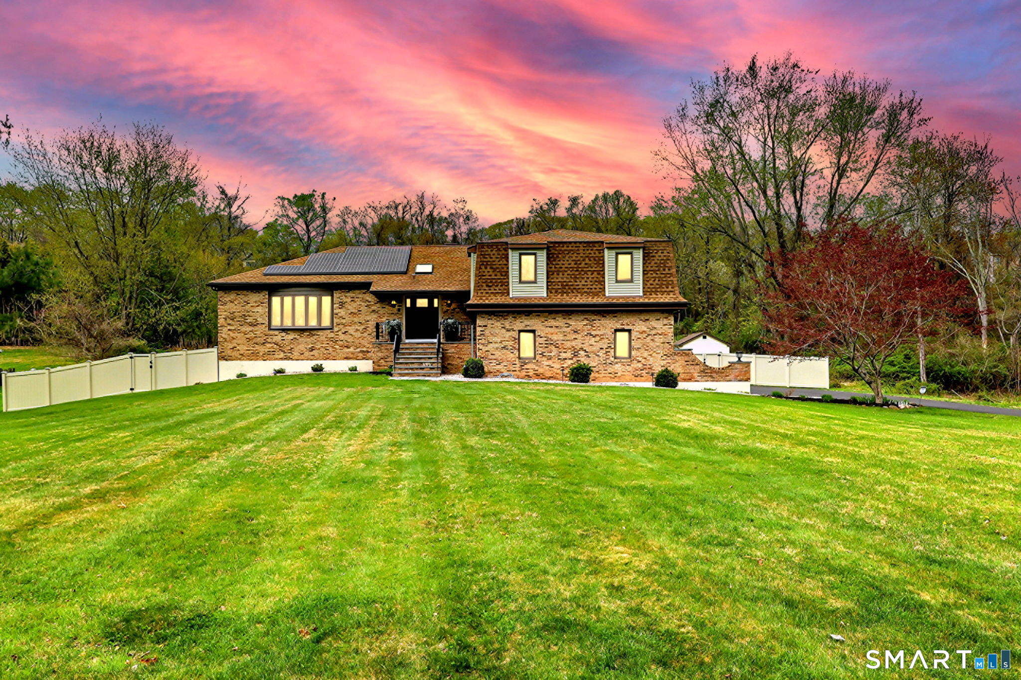 2262 Ridge Road North Haven, CT 06473 - Photo 1 of 40 a front view of a house with a yard and trees