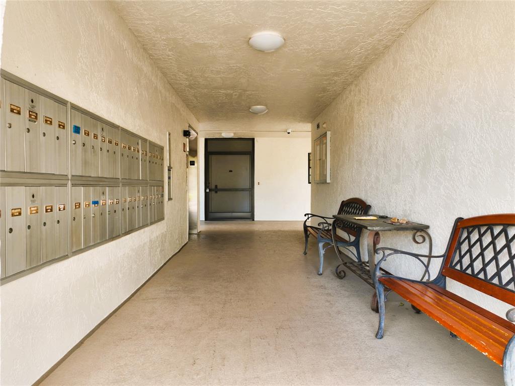 9170 Southwest 14th Street, Unit 4409 Boca Raton, FL 33428 - Photo 3 of 26 a living room with furniture and a large window