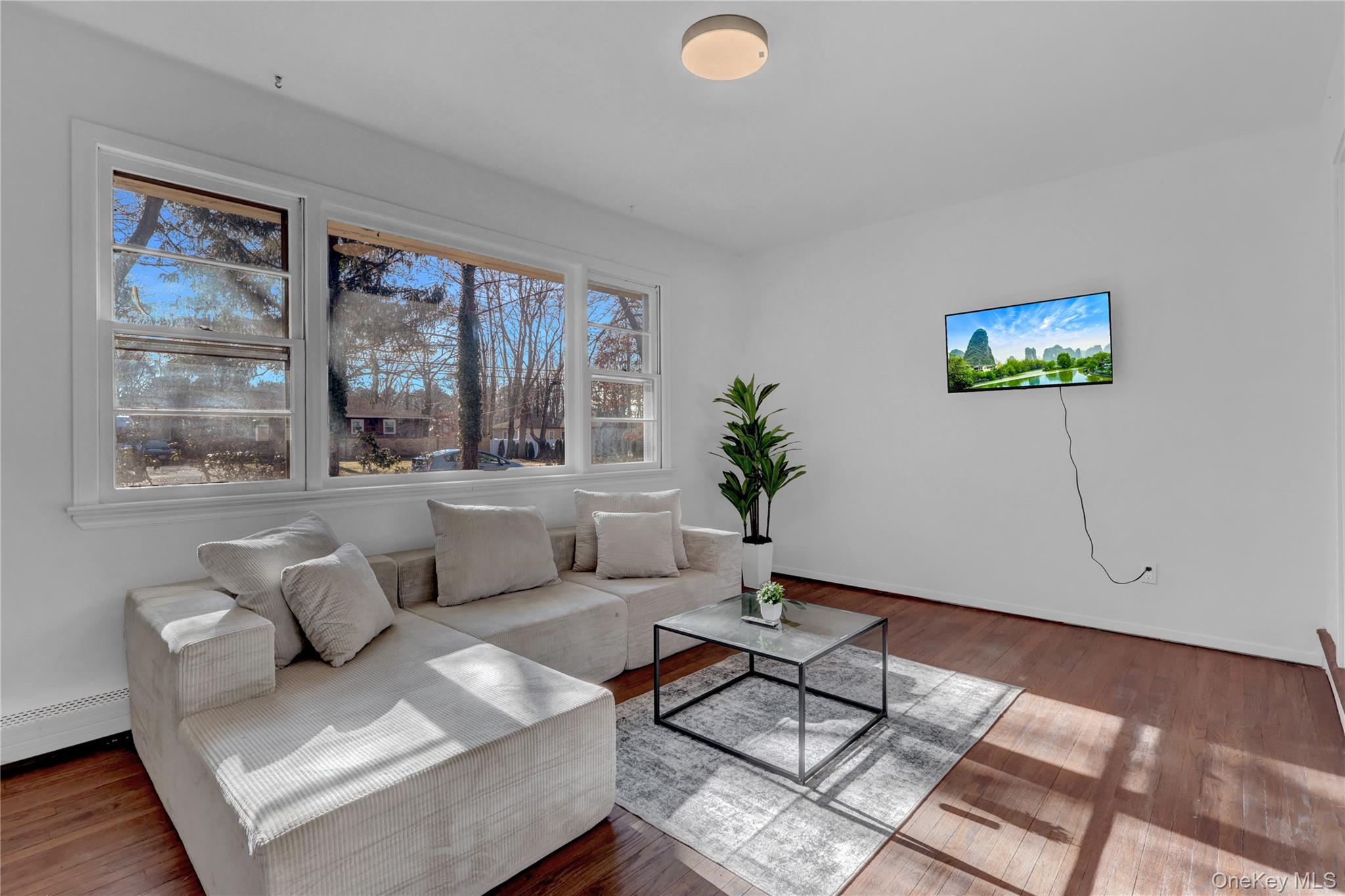 57 Middle Island Road Medford, NY 11763 - Photo 3 of 28 a living room with furniture and a large window