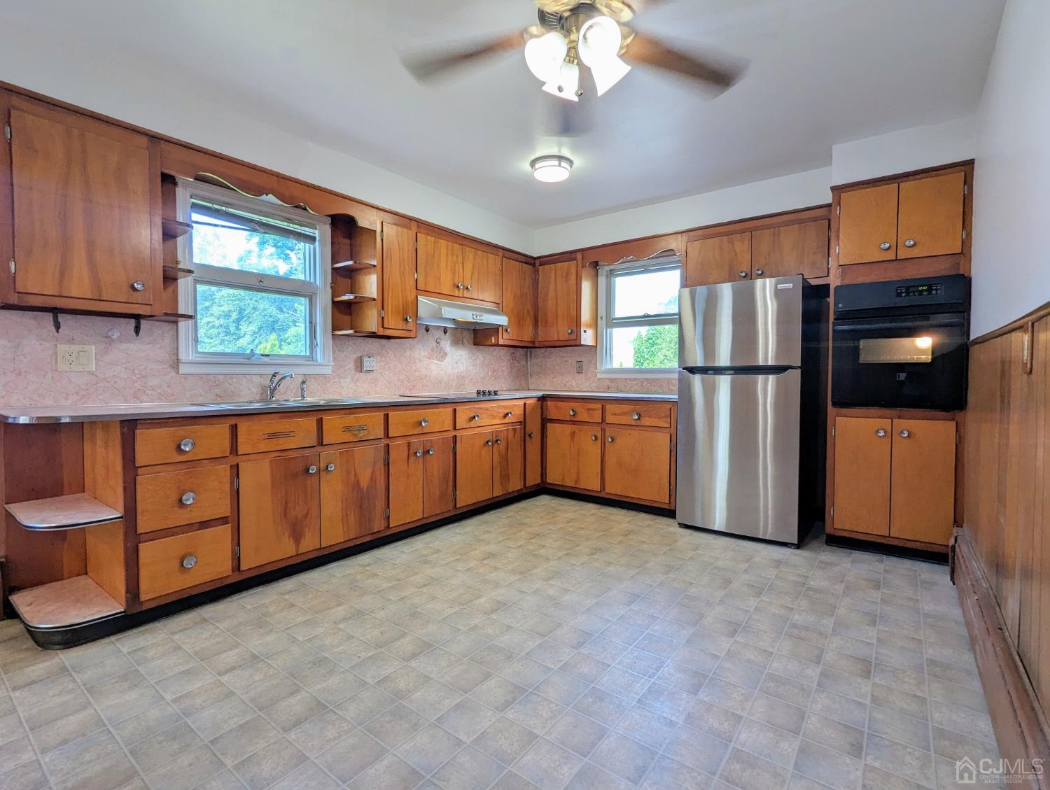 107 Madison Avenue, Unit 2 Dunellen, NJ 08812 - Photo 5 of 18 a kitchen with stainless steel appliances a refrigerator and a sink