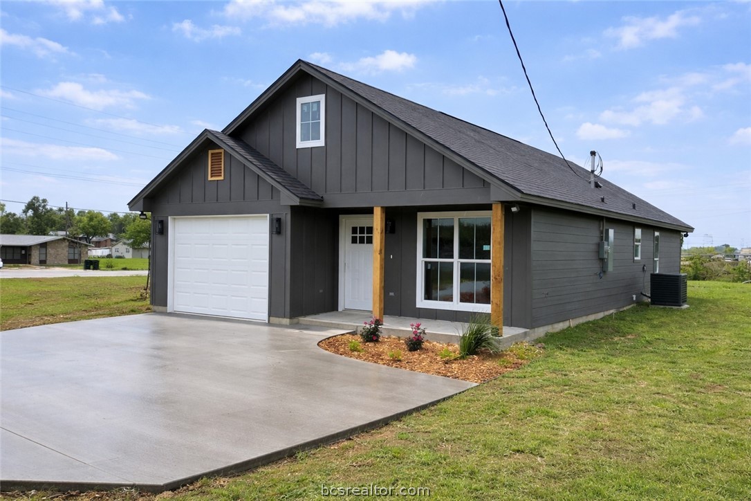 309 Wheelock Street Franklin, TX 77856 - Photo 1 of 15 a view of a house with backyard and garden