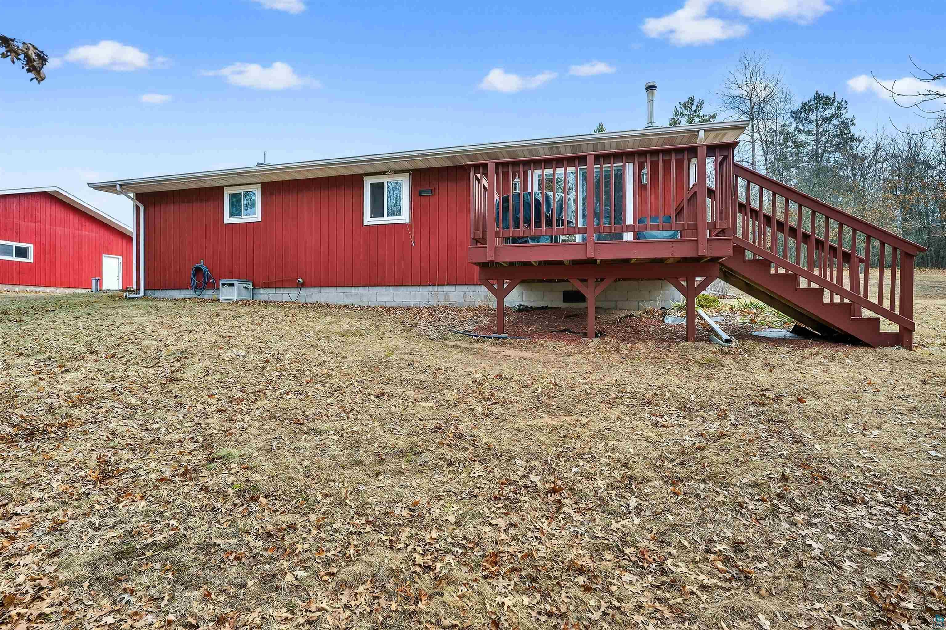 11702 East Mail Road Gordon, WI 54838 - Photo 10 of 49 Rear view of property with stairway and a deck