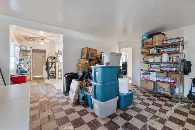 a living room with a couch and a book shelf