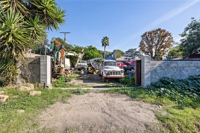an aerial view of a houses with yard