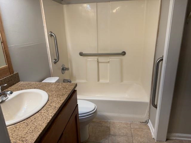 1315 Florida Street Memphis, TN 38106 - Photo 14 of 14 a bathroom with a granite countertop sink toilet and shower
