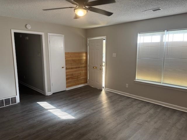 1315 Florida Street Memphis, TN 38106 - Photo 3 of 14 an empty room with wooden floor cabinet and windows