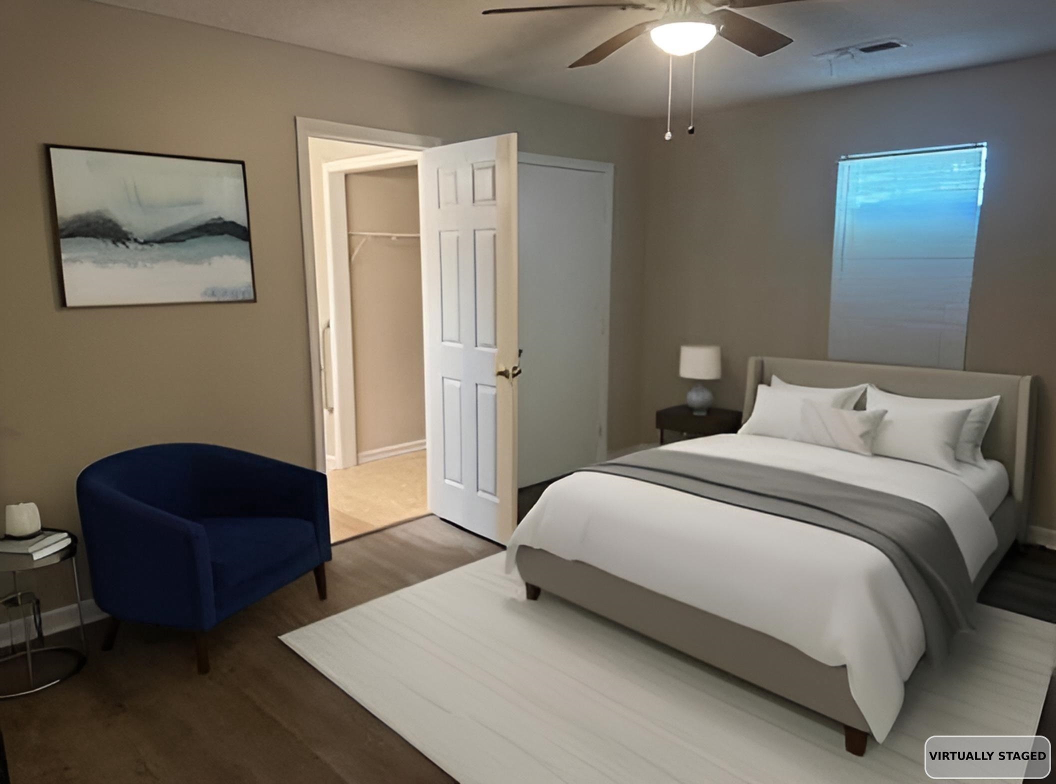 1315 Florida Street Memphis, TN 38106 - Photo 9 of 14 a spacious bedroom with a bed and a chandelier