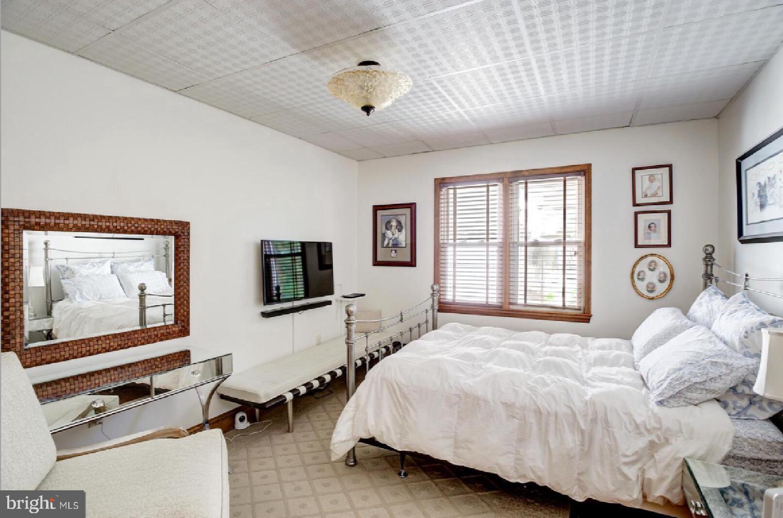 105-107 Franklin Road Glassboro, NJ 08028 - Photo 16 of 33 a bedroom with a bed and a flat screen tv
