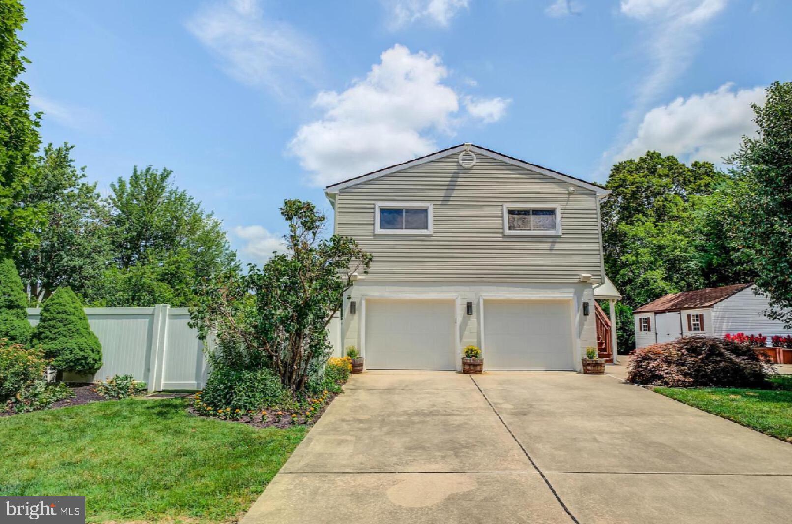 105-107 Franklin Road Glassboro, NJ 08028 - Photo 33 of 33 a front view of a house with a yard and garage