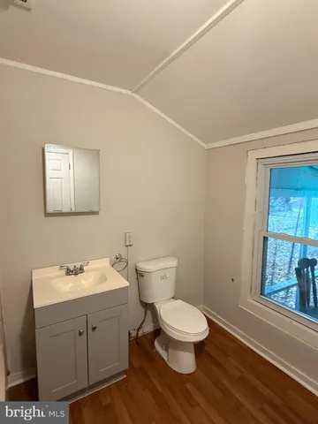 a bathroom with a shower and a sink