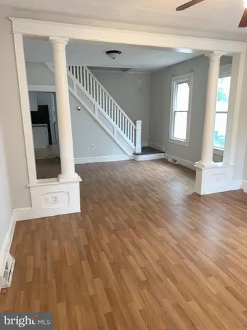 a kitchen with a refrigerator stove and white cabinets