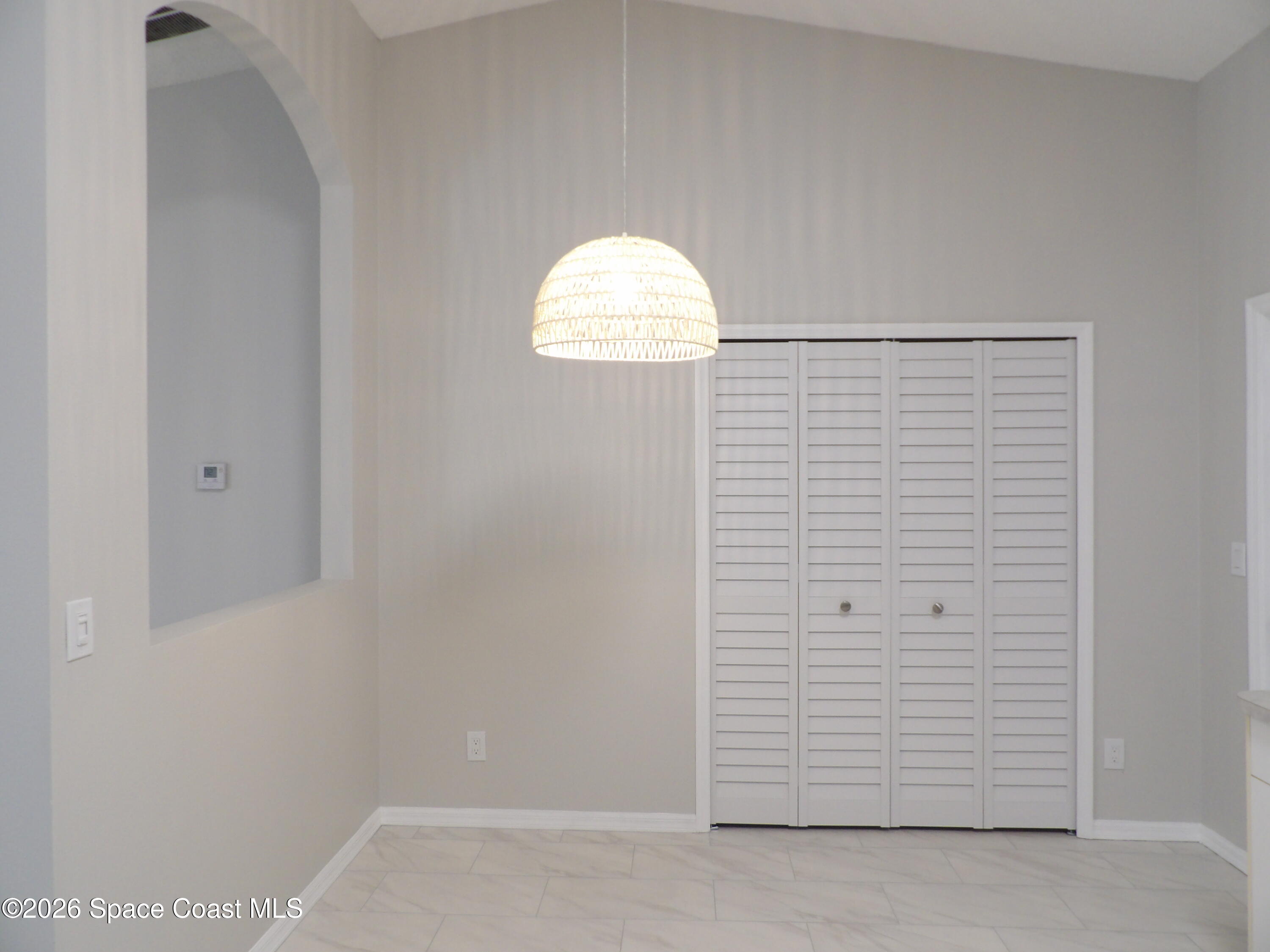 542 Octavius Road Southwest Palm Bay, FL 32908 - Photo 12 of 33 an empty room with windows